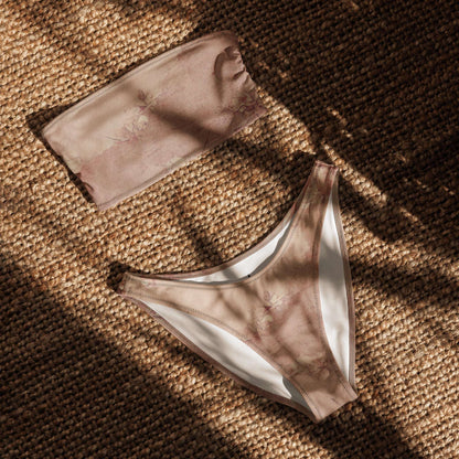 Flat lay of the Dusty Pink Cottagecore Bandeau Bikini showing the strapless top and high-leg V-cut bottoms. This soft girl aesthetic swimsuit features romantic pastel tones, made from eco-friendly recycled fabric with UPF 50+ protection. The simple yet elegant design makes it a perfect summer staple for beach days, pool lounging, or festival season. Available in inclusive sizes 2XS–6XL.
