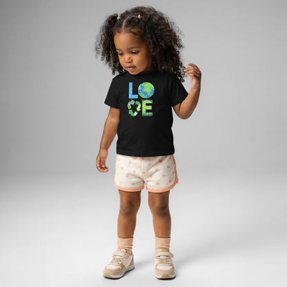 Eco conscious baby clothing featuring Earth Day graphic tee with Earth, recycling, and nature symbols