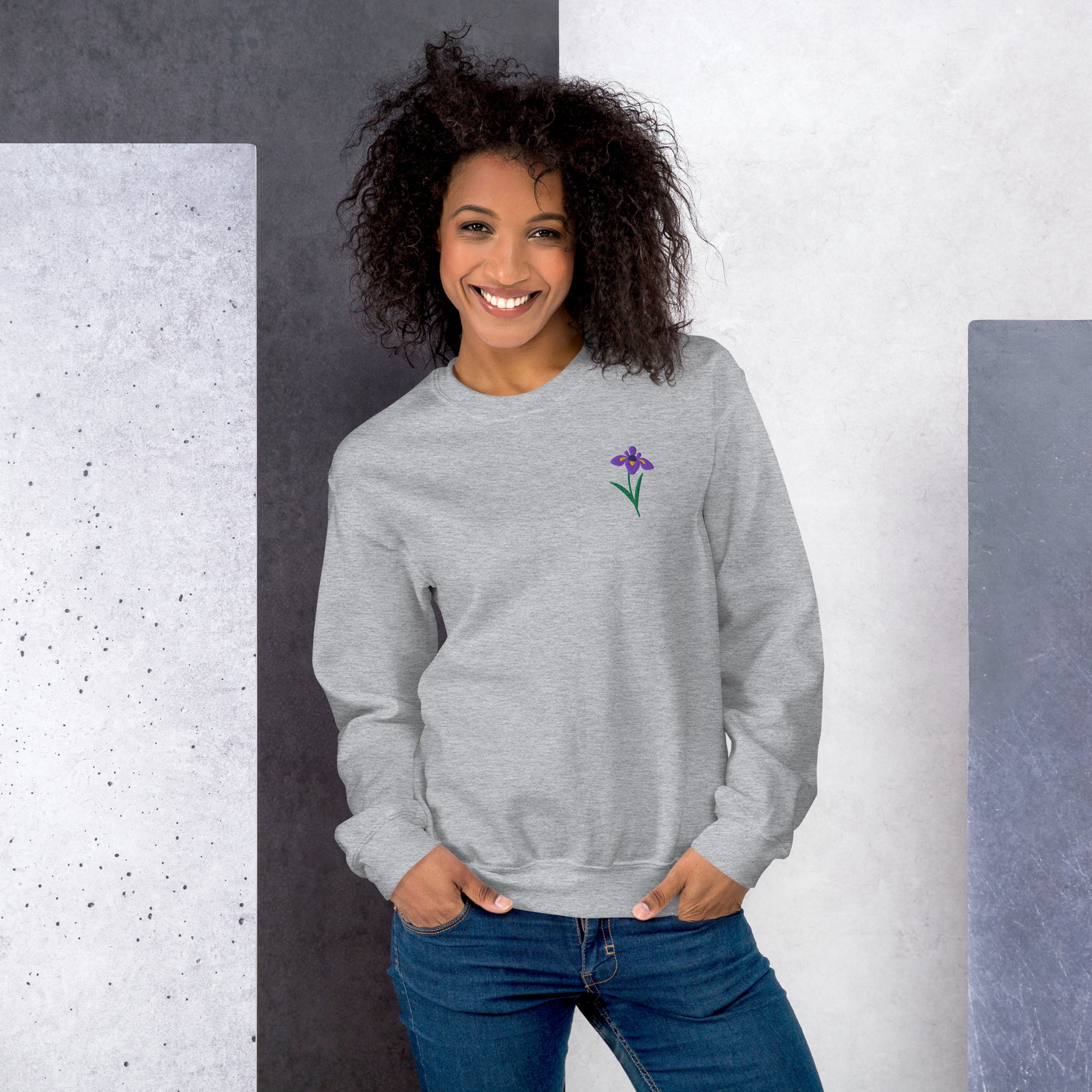 Floral embroidered sweatshirt featuring an iris motif, symbolizing wisdom and hope. This cozy top adds a feminine touch to casual days while celebrating the February birth flower. Soft and breathable fabric makes it ideal for lounging, coffee runs, or gifting to someone special who loves botanical and cottagecore fashion.