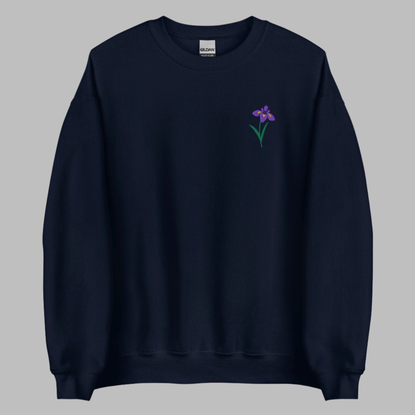 Image: A beautifully embroidered iris flower crewneck sweatshirt in a soft, relaxed fit. This custom floral design adds an elegant touch to any wardrobe, making it a meaningful Mother's Day gift or a thoughtful present for nature lovers. The intricate embroidery captures the essence of the bearded iris, creating a timeless piece that celebrates botanical beauty and personal style, by jaecrece.