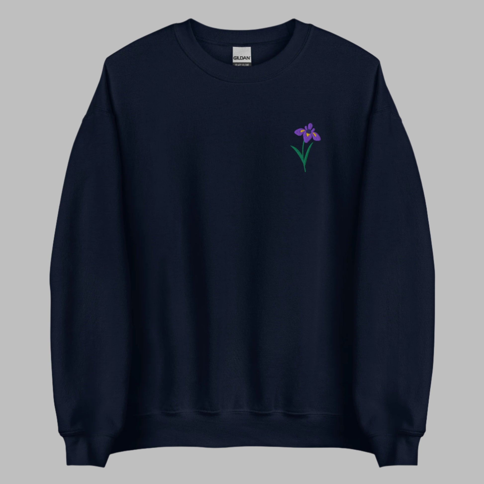 Image: A beautifully embroidered iris flower crewneck sweatshirt in a soft, relaxed fit. This custom floral design adds an elegant touch to any wardrobe, making it a meaningful Mother's Day gift or a thoughtful present for nature lovers. The intricate embroidery captures the essence of the bearded iris, creating a timeless piece that celebrates botanical beauty and personal style, by jaecrece.
