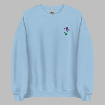 Image: A beautifully embroidered iris flower crewneck sweatshirt in a soft, relaxed fit. This custom floral design adds an elegant touch to any wardrobe, making it a meaningful Mother's Day gift or a thoughtful present for nature lovers. The intricate embroidery captures the essence of the bearded iris, creating a timeless piece that celebrates botanical beauty and personal style, by jaecrece.