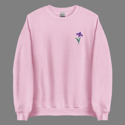 Embroidered iris flower sweatshirt designed for comfort and style. The floral motif represents February’s birth flower, making it a thoughtful gift for birthdays or Mother’s Day. Soft and durable, this women’s crewneck suits both casual and elevated looks. Ideal for botanical, cottagecore, or soft girl aesthetic wardrobes.
