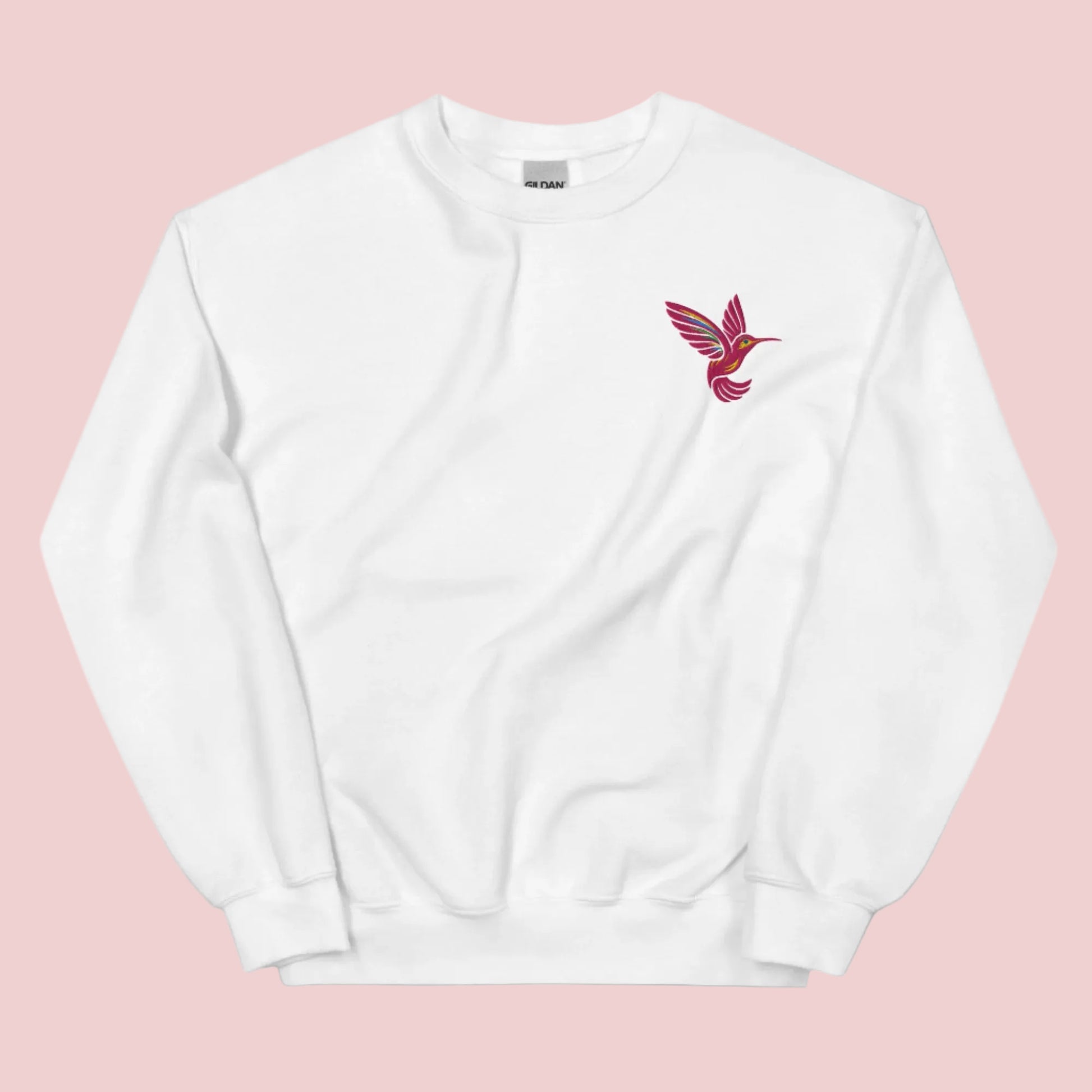Embroidered bird sweatshirt with hummingbird design on soft unisex Gildan 18000 crewneck. Nature themed clothing with delicate stitching that adds charm to everyday outfits. Perfect for women who love floral and botanical aesthetic fashion. Ideal for gifting, casual wear, and cozy weekends. Comfortable cotton blend fabric available in sizes S to 5XL.