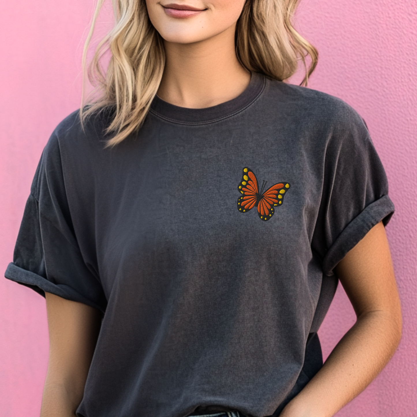 Image: Comfort Colors Pepper t-shirt with an embroidered monarch butterfly, perfect for embracing granola girl or clean girl aesthetic. With subtle spring energy and delicate embroidery, this breathable cotton tee fits right into minimal Earth Day outfits and is a lovely eco-friendly clothing gift for women who love bees, blooms, and butterflies, by jaecrece.