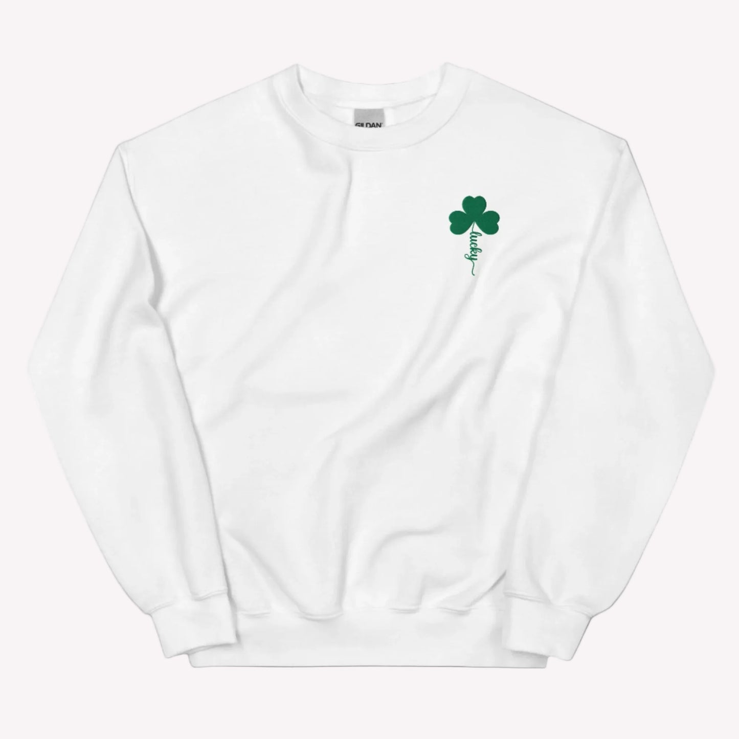 Embroidered shamrock holiday sweatshirt by JaeCrece featuring a classic white crewneck design, green lucky clover detail, and made to order small business apparel.