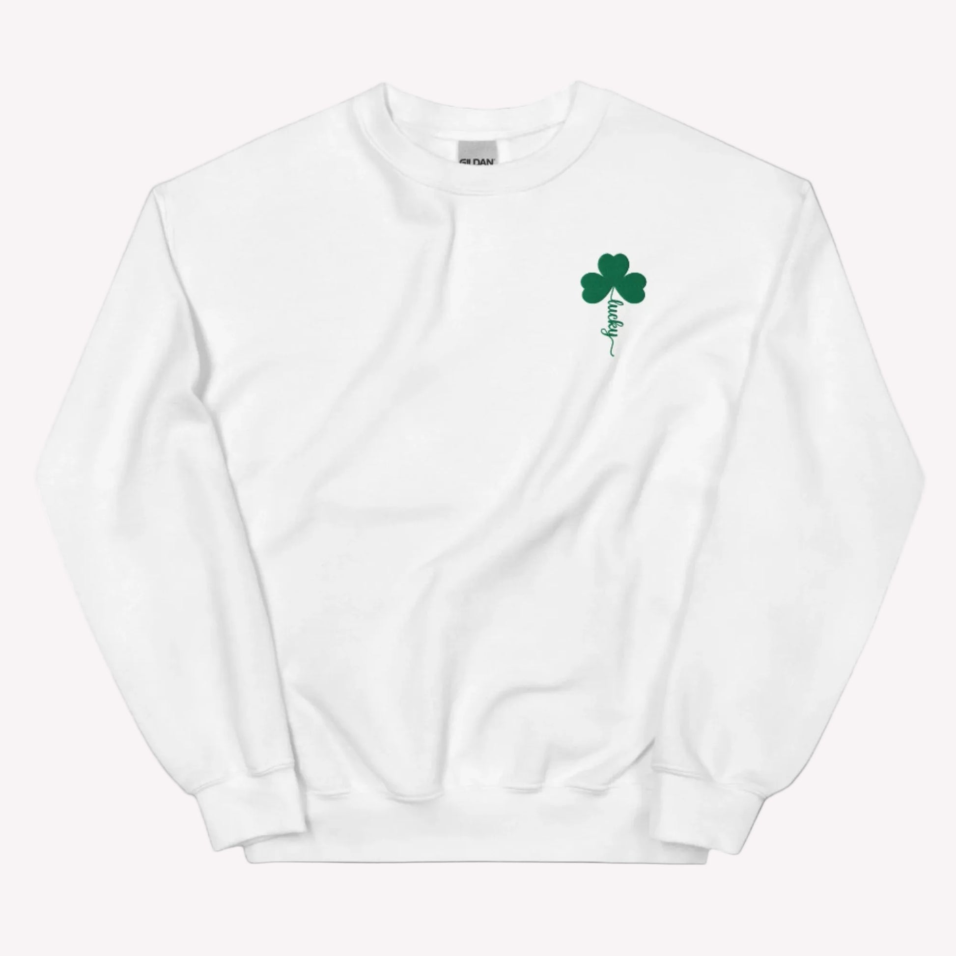 Embroidered shamrock holiday sweatshirt by JaeCrece featuring a classic white crewneck design, green lucky clover detail, and made to order small business apparel.