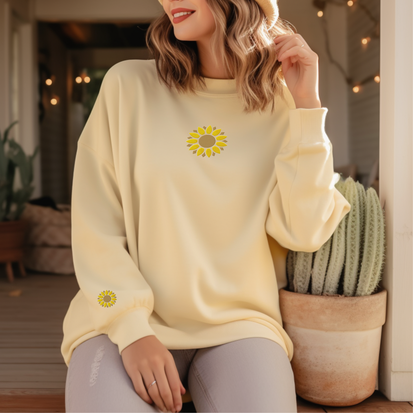 Butter yellow Comfort Colors sweatshirt with sunflower embroidery stitched on the center chest and right wrist. The soft fleece interior and relaxed silhouette make it a comfortable choice for cooler weather. This embroidered floral crewneck is a thoughtful gift for gardeners, flower enthusiasts, teachers, moms, and anyone who appreciates botanical inspired fashion with timeless appeal.