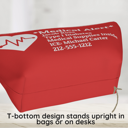 A red medical alert pouch with white printed text and a white heart monitor graphic, shown on a light background with a text overlay at the bottom explaining its T-bottom design. T bottom design of a medical alert pouch showing the structured base that helps the pouch stand upright.