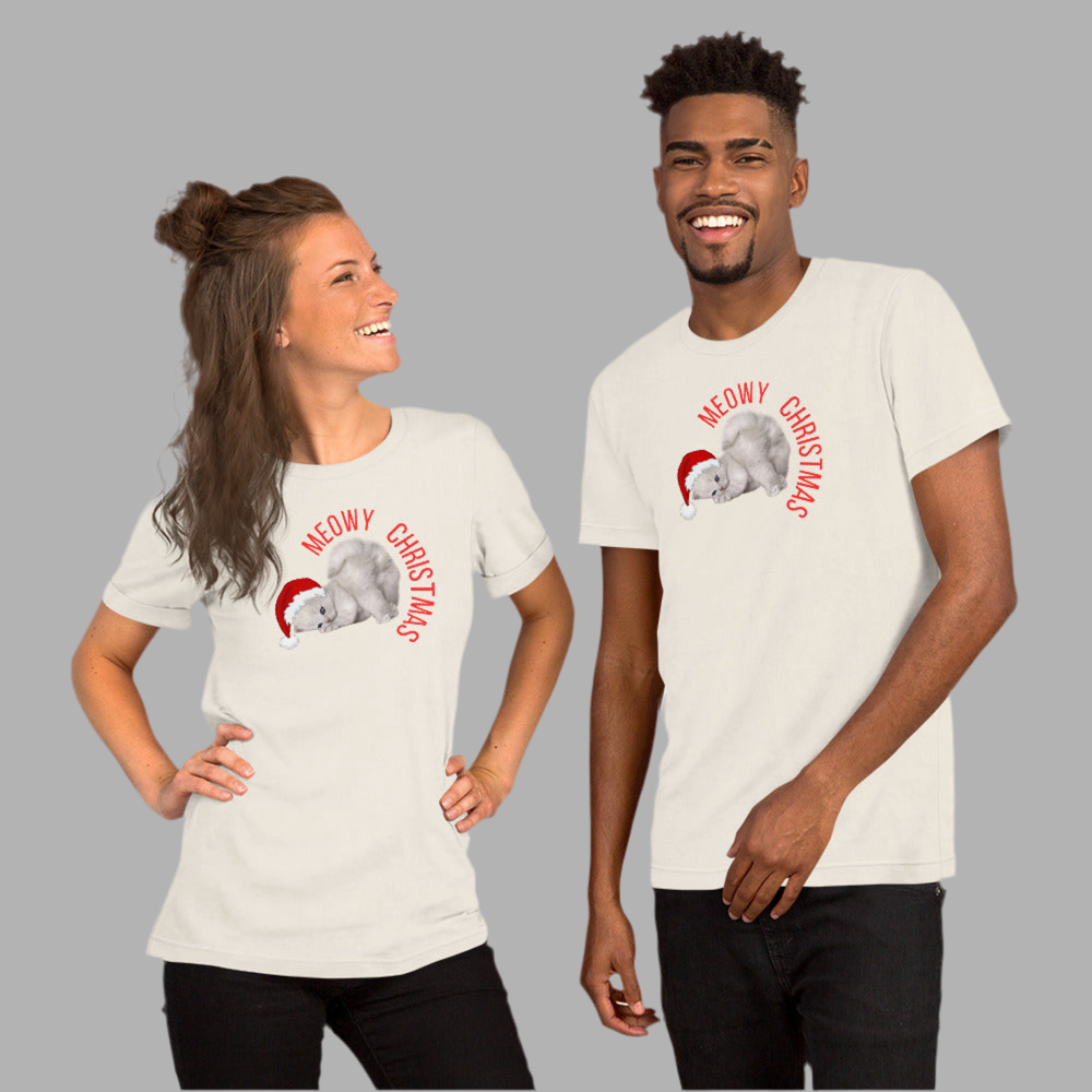 This Meowy Christmas shirt for adults features a large cartoon-style grey kitten with blue eyes in a red Santa hat and the phrase “Meowy Christmas” in festive lettering. Designed in unisex sizes XS–5XL, it’s soft, comfy, and great for matching family looks. Pair it with coordinating kids’ shirts, sweatshirts, or a matching holiday blanket. Ideal for cat lovers, funny family Christmas photos, or stocking stuffers.