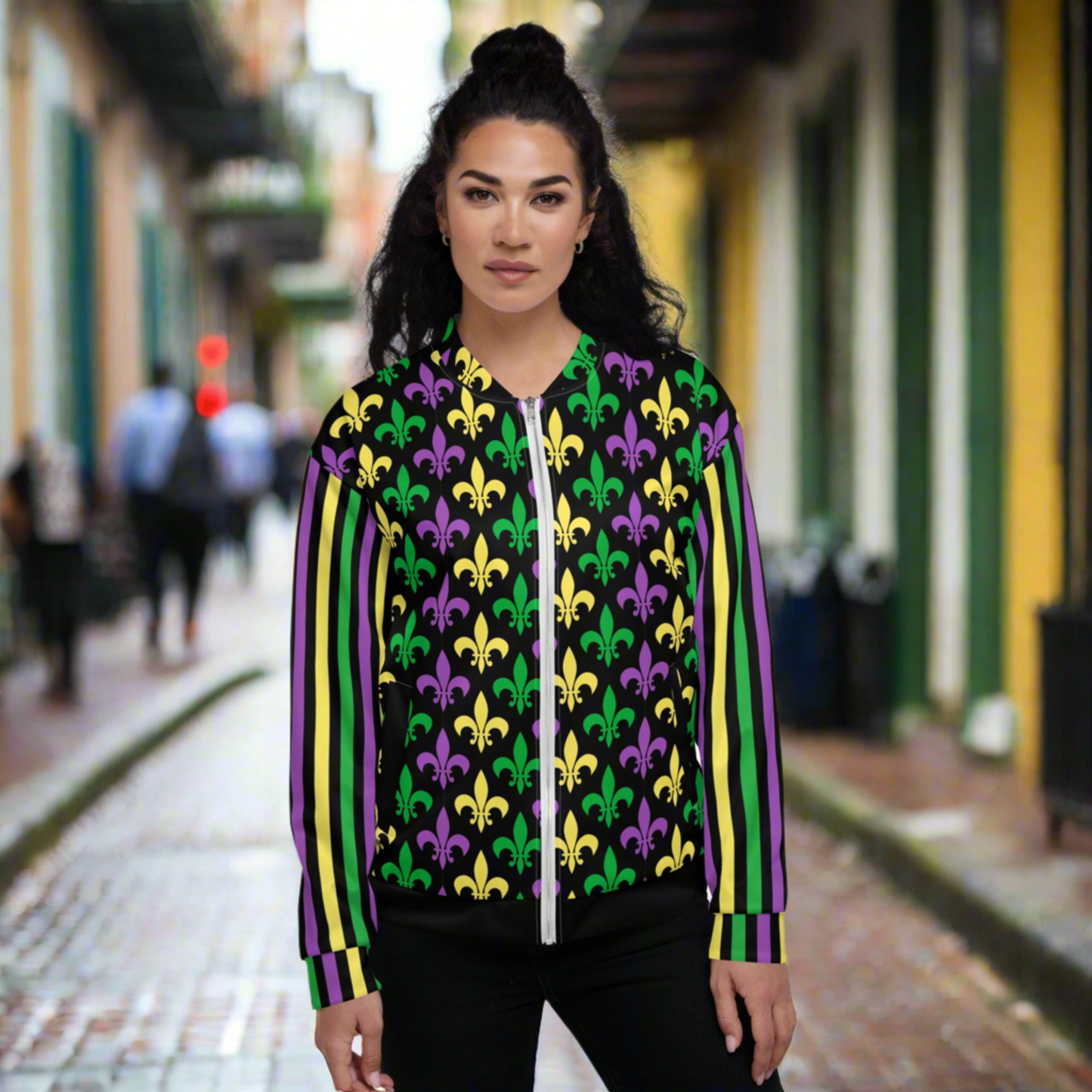 Image: Mardi Gras Unisex Bomber Jacket. This lightweight NOLA apparel is perfect for parades in the French Quarter, or Mardi Gras themed fun runs. It features a gold, green and purple fleur de lis pattern on the front and back, with gold, purple and green stripes going down each arm. Plus sizes available, by jaecrece