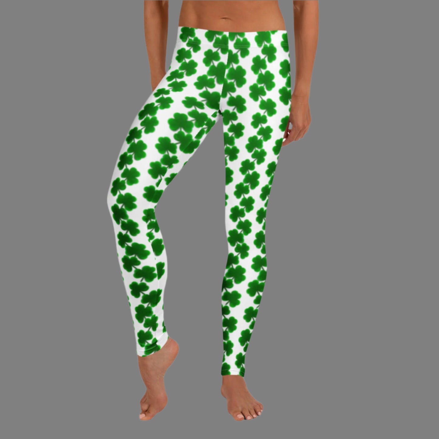 Image: St Patricks Day Leggings for toddler girls, tween, teens and women.Celebrate March in style with these women’s shamrock leggings featuring a chain of clovers on a clean white base. These leggings offer a mid-rise fit and full ankle-length cut, crafted from soft, stretchy fabric perfect for St. Patrick’s Day gatherings, parades, or casual wear. Pair with matching kids' leggings for a fun family celebration look. Available in sizes XS to XL.