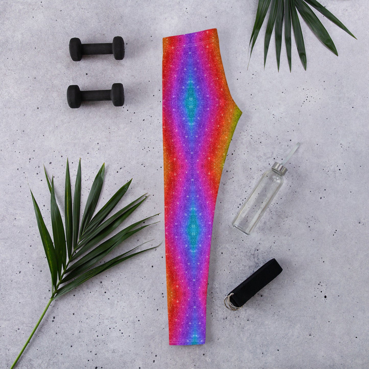 Dazzle in rainbow swirl leggings with a faux glitter holographic look. These bold women’s leggings are perfect for Pride festivals, LGBTQ+ events, and Mardi Gras. With all-day comfort, UV protection, and a flexible fit, they’re ready for running, dancing, or lounging. Part of a matching set available in youth and toddler sizes.
