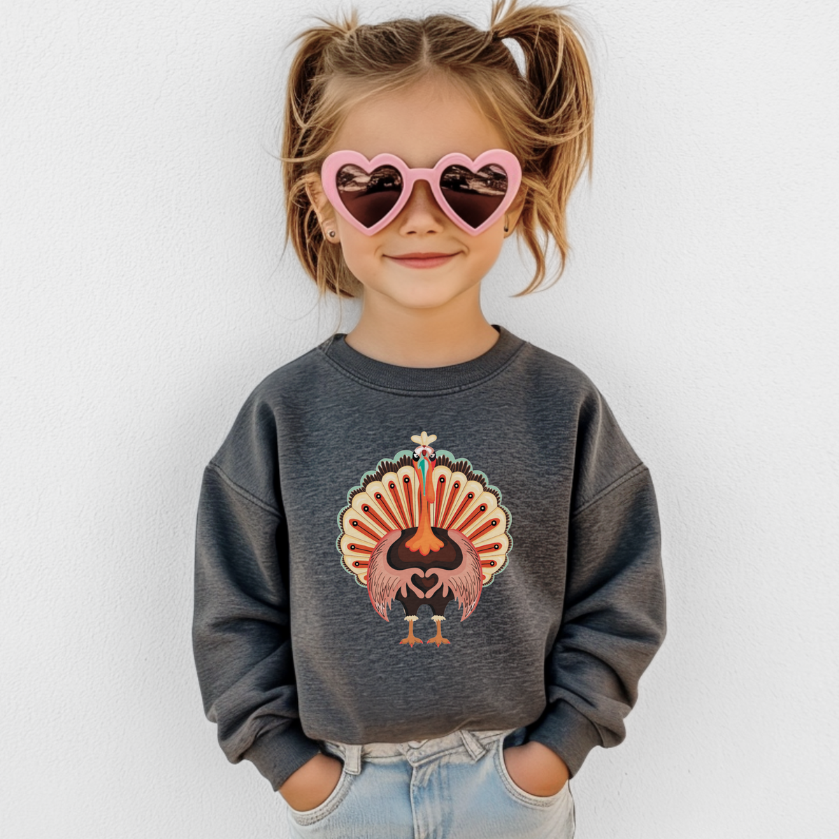 Youth Turkey Love sweatshirt featuring a cheerful colorful turkey holding its wings together in a heart shape, perfect for matching family Thanksgiving outfits