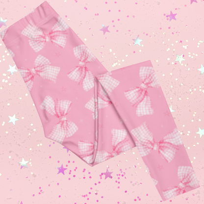 Pink Bow Coquette leggings for girls, sizes toddler 2T–7 and youth 8–20, soft, breathable, and stretchy polyester-spandex blend, four-way recovery fabric, cute gingham bow print, ideal for everyday wear, special occasions, photoshoots, or coordinated family outfits, made-to-order for high-quality, comfortable, and stylish leggings for young girls.