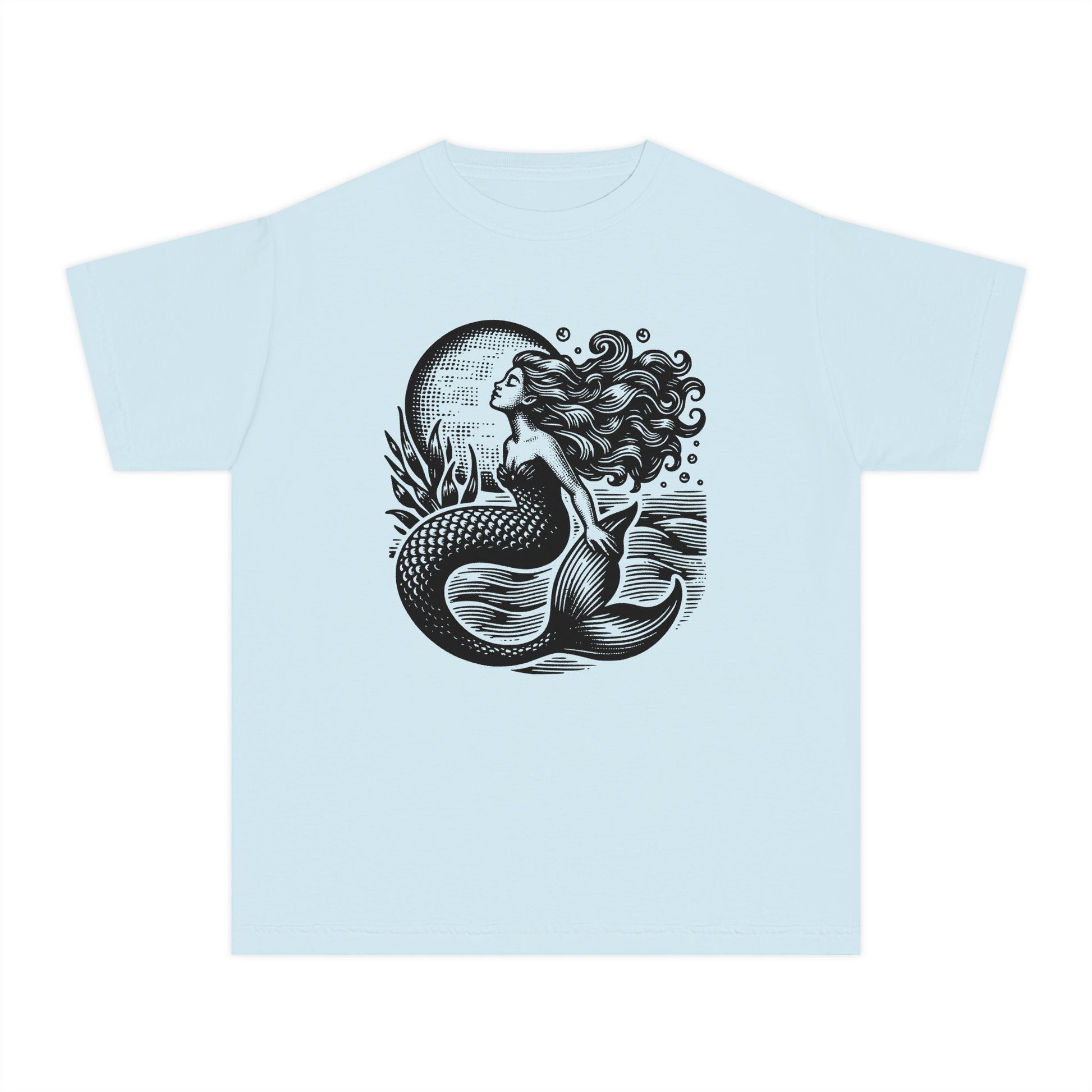 Girls Comfort Colors mermaid t shirt featuring a linocut inspired coastal illustration of a mermaid rising through textured ocean waves beneath a bright full moon. Soft garment dyed youth graphic tee with a relaxed vintage feel perfect for beach vacations summer outfits school days and matching mommy and me looks. Ideal for ocean loving girls who love nautical fashion mermaidcore style seaside adventures whimsical artwork and trendy coastal aesthetic clothing with comfortable everyday wear appeal.