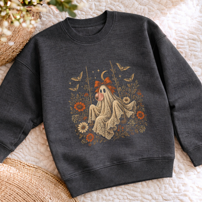 dark heather Halloween sweatshirt featuring a vintage inspired ghost blowing a bubble with bubble gum, surrounded by orange flowers, botanical foliage, bats, stars, lace details and a bow. A playful spooky season outfit for girls who love vintage Halloween style.
