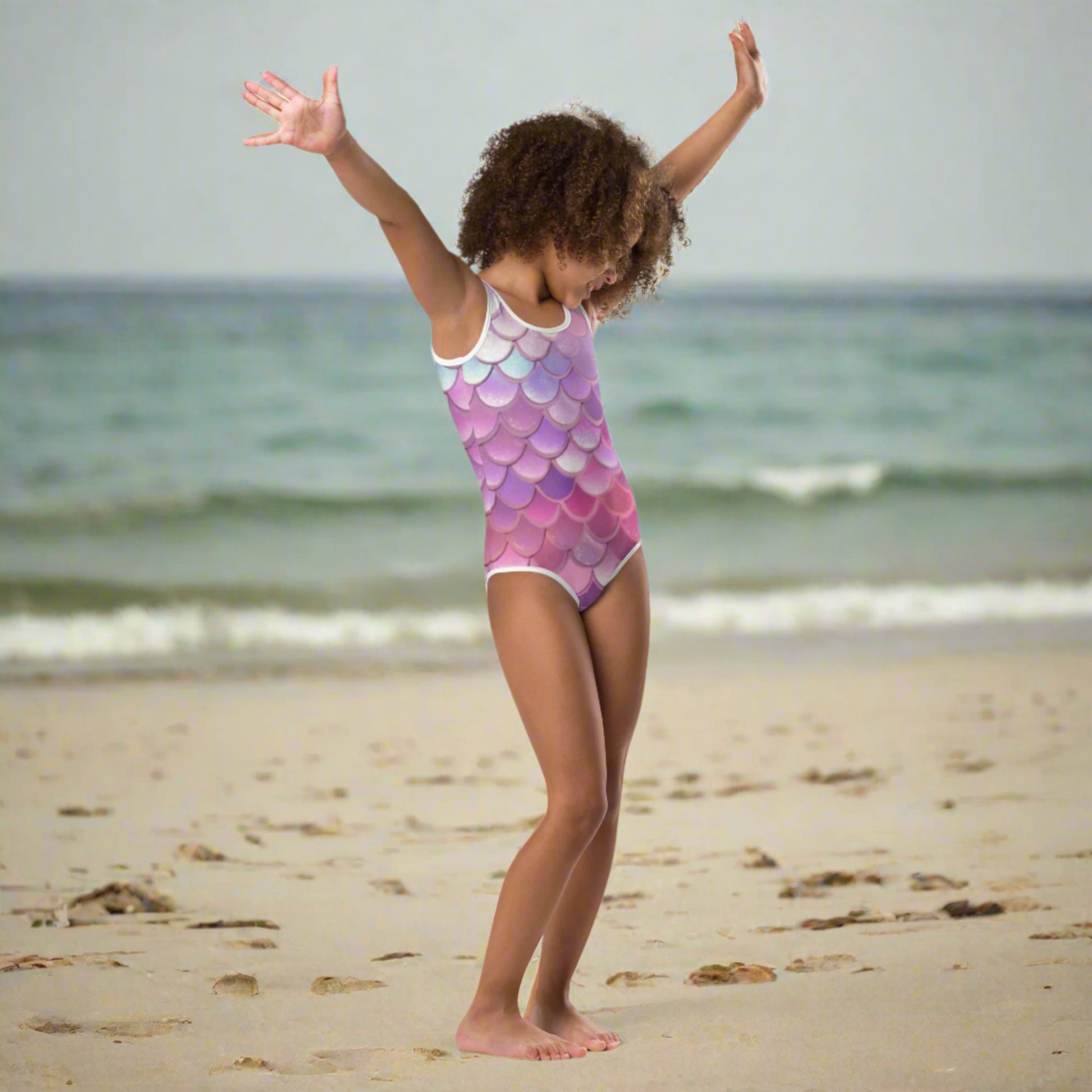  Mermaid Swimsuits by JaeCrece, featuring colorful pink, purple, blue, and white mermaid scale prints. Available in toddler sizes 2T–7 and youth sizes 8–20, these swimsuits combine four-way stretch microfiber fabric with double-layered fronts and UPF 38–40 protection. Ideal for family vacations and coordinated swimwear looks