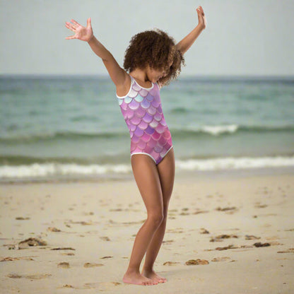 Mermaid Swimsuits by JaeCrece, featuring colorful pink, purple, blue, and white mermaid scale prints. Available in toddler sizes 2T–7 and youth sizes 8–20, these swimsuits combine four-way stretch microfiber fabric with double-layered fronts and UPF 38–40 protection. Ideal for family vacations and coordinated swimwear looks