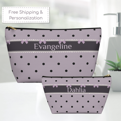 Personalized gothic coquette makeup bag in lavender and black featuring bows, polka dots, lace inspired details and elegant lettering. The canvas zipper pouch can be customized with a name or initials, making it a stylish cosmetic bag for makeup, skincare and everyday essentials. Its dark romance aesthetic adds a feminine vintage touch.