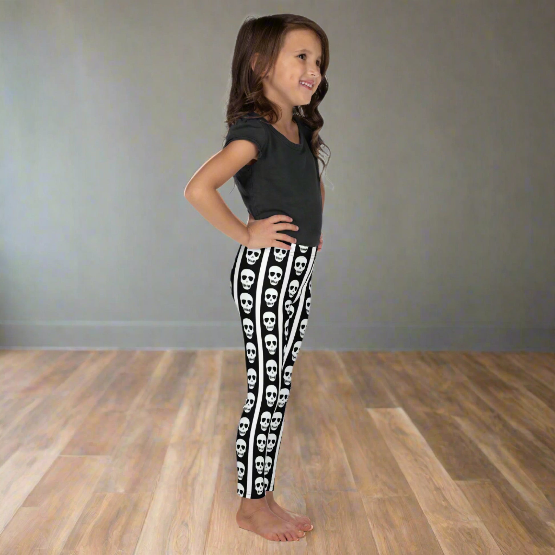 Image: These toddler and children’s leggings feature alternating black and white stripes with a trail of skulls down each leg, perfect for little ones who love Halloween or cool designs. Crafted for movement and comfort, they’re great for school events, themed birthdays, or everyday wear with a little extra attitude. Available in sizes for toddlers and young kids, by jaecrece.

