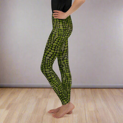 Reptile print youth girls leggings, size 8-20. These green yoga pants have a black reptile print pattern. These tights are available in plus/ extended sizes, and are perfect for casual wear, cosplay, Halloween Trick or treating or yoga class. Similar to a snake, lizard or dinosaur print, by jaecrece
