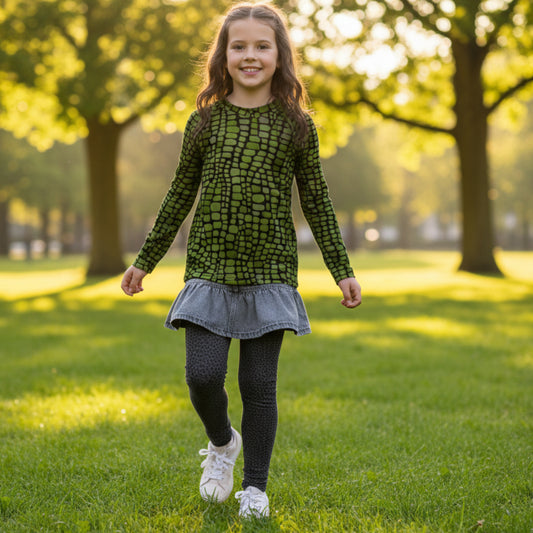 Youth long sleeve rash guard with green reptile pattern in sizes 8–20, perfect for snake, dinosaur, and lizard costumes. Ideal for swimming, beach play, and sunny days, it offers UPF protection and bold, all-over print style. Designed for tweens who enjoy dressing up, exploring, and having fun outdoors. Great for jungle themes, summer camps, or costume parties. A unique swimwear piece for animal lovers.