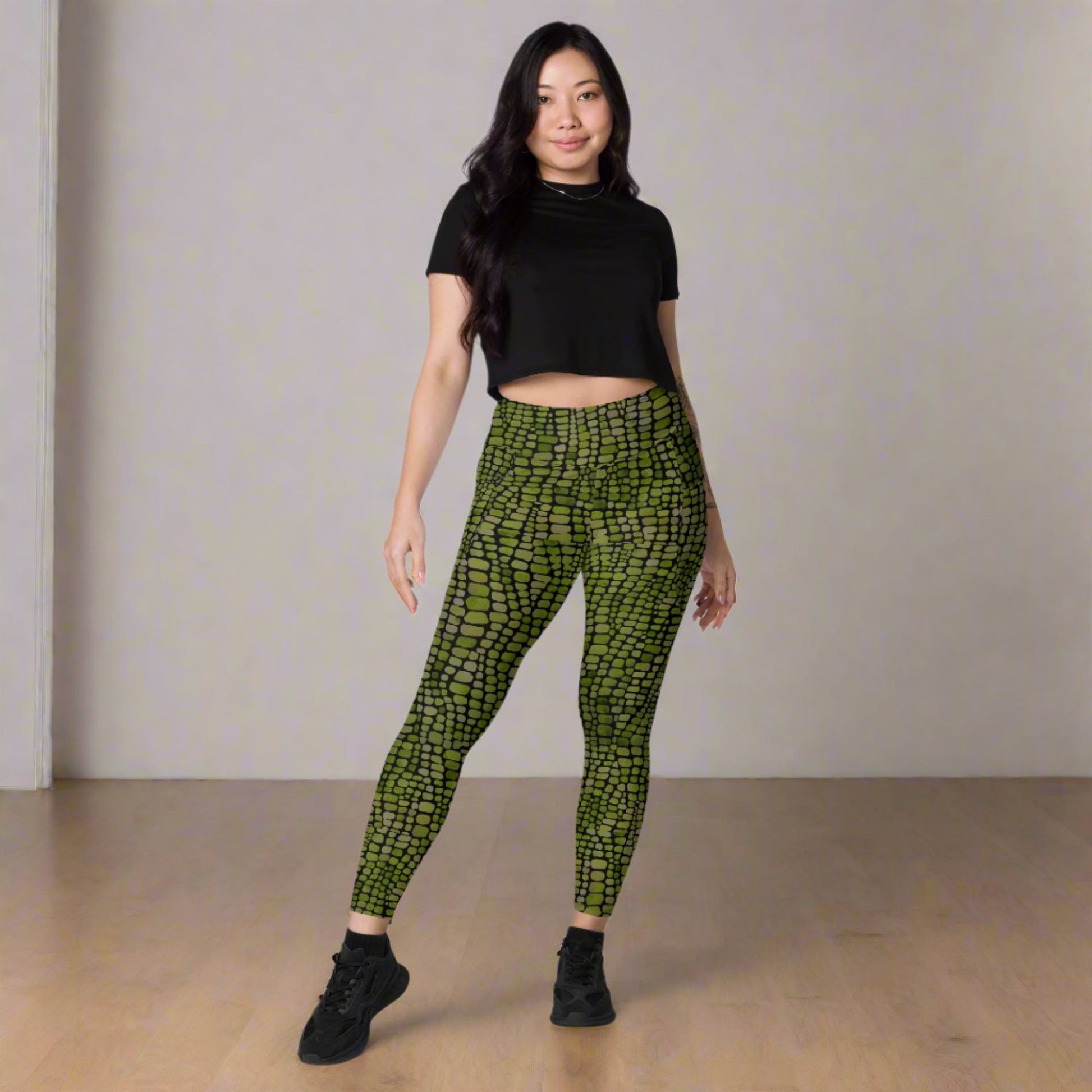 Reptile print ladies leggings. These green yoga pants have a black reptile print pattern. These tights are available in plus/ extended sizes, and are perfect for casual wear, cosplay, Halloween Trick or treating or yoga class. Similar to a snake, lizard or dinosaur print, by jaecrece