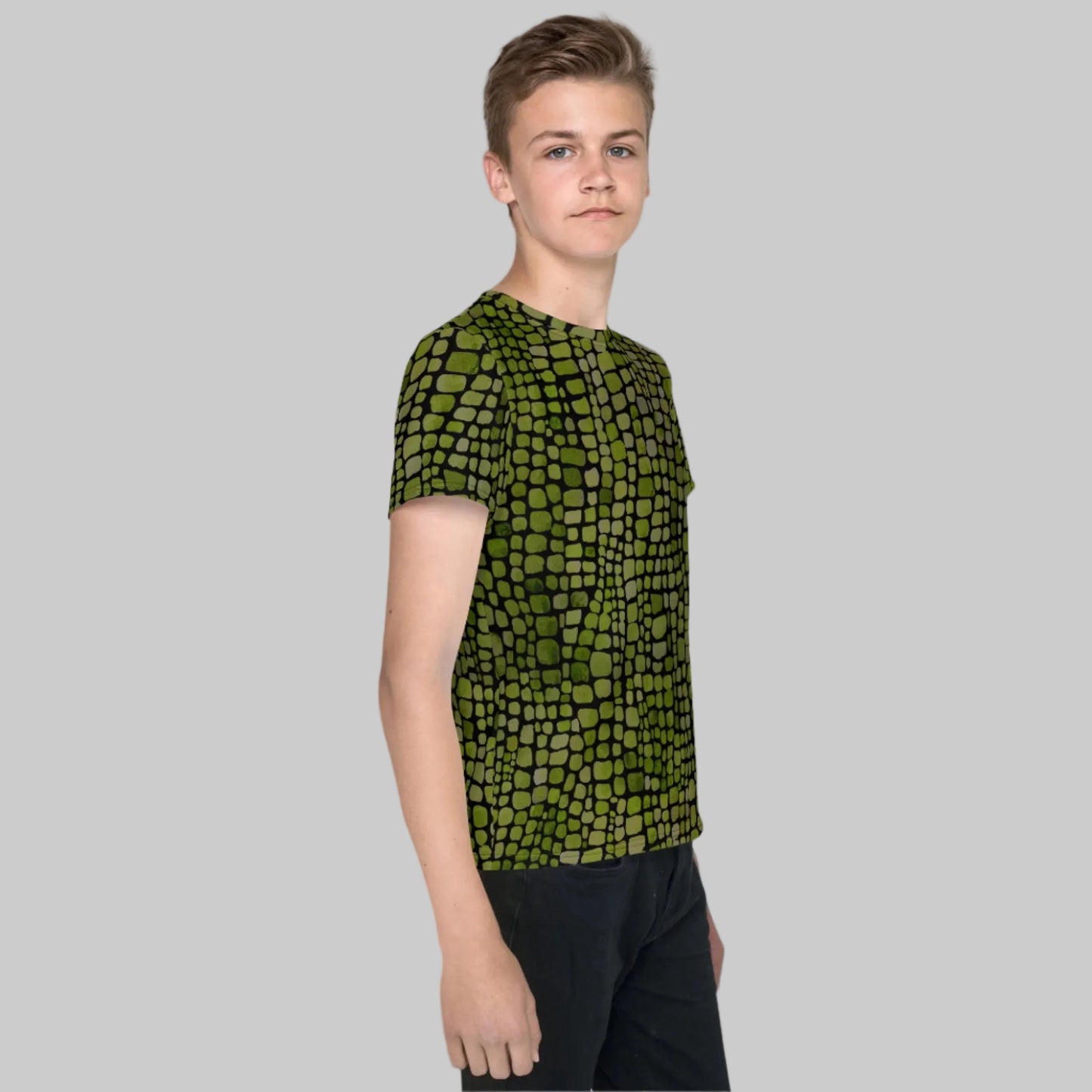 Green reptile print youth t-shirt for boys and girls in sizes 8–20. This all-over scale design is perfect for snake, lizard, or dinosaur costumes and makes a fun statement for nature lovers. A versatile pick for themed birthdays, jungle parties, school events, and everyday wear. Lightweight, breathable fabric and vivid design make it a hit for summer, outdoor adventures, and kids who love bold, wild prints.