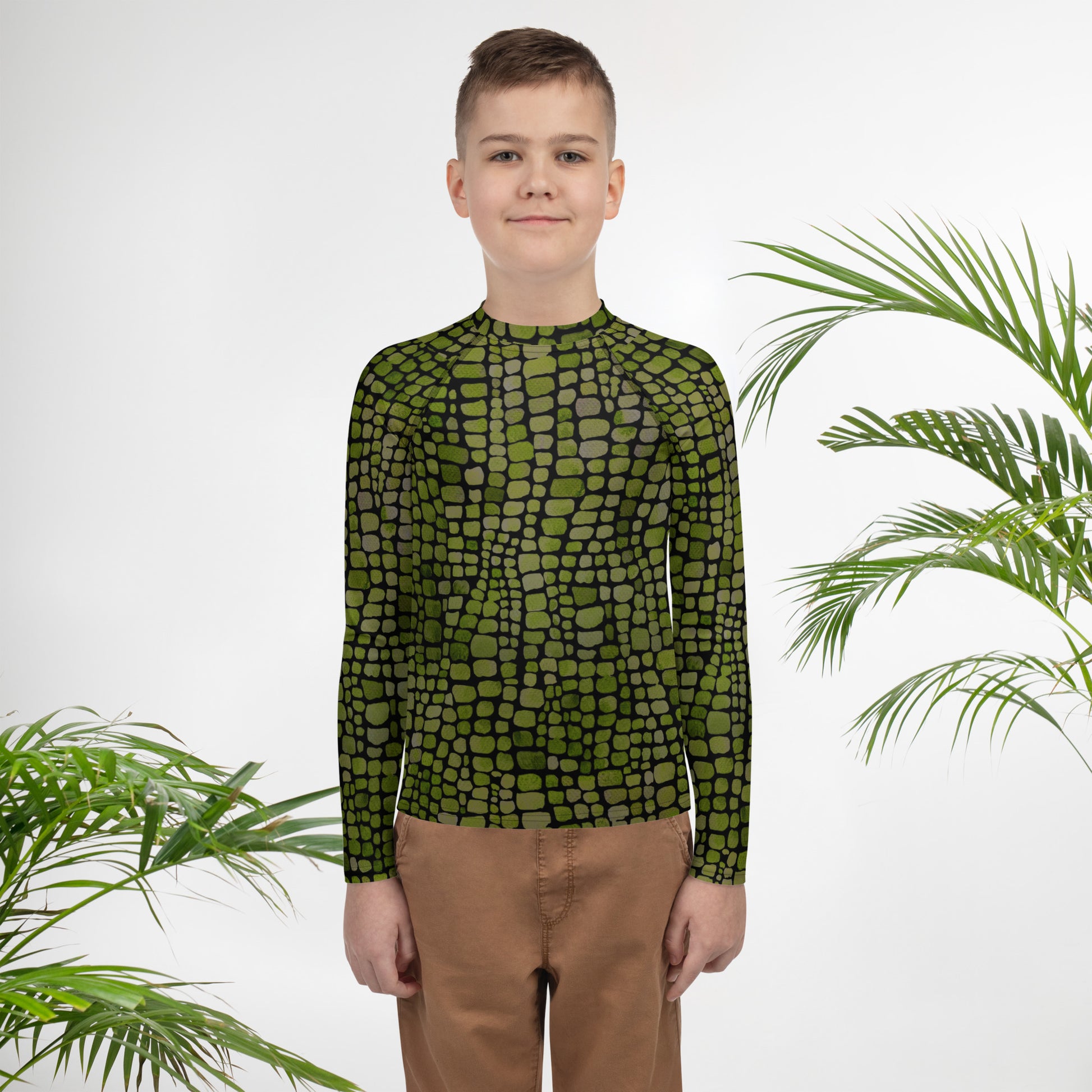 Green reptile rash guard for youth in sizes 8–20, perfect for snake, dinosaur, or lizard costumes and beachwear. This long sleeve swim shirt features all-over green scales and sun-safe fabric for water play or summer vacations. Designed for kids who love imaginative dress-up, animals, and jungle themes, it’s ideal for pools, water parks, or themed birthday parties. A fun and fierce option for costume-loving tweens.
