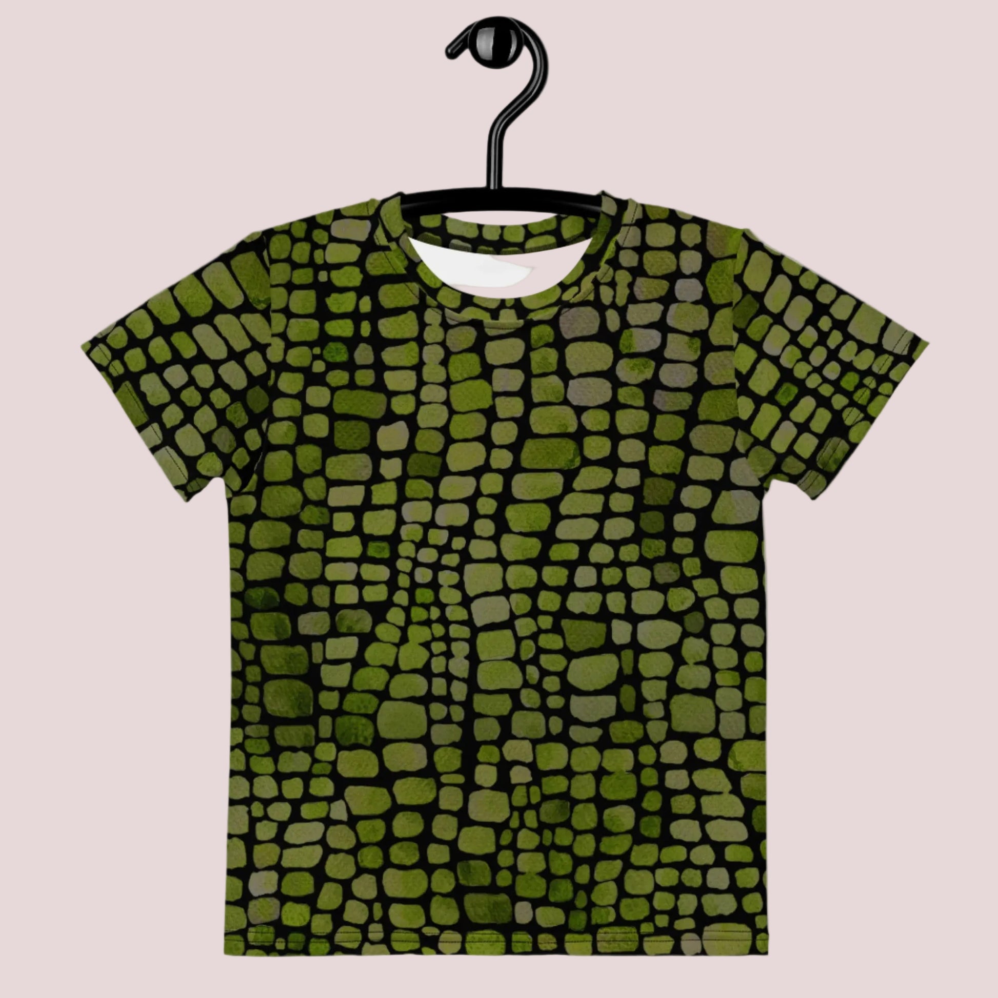 Green scale print kids shirt in sizes 2T–7, ideal for use as a base for lizard, dinosaur, snake, or serpent Halloween costumes. The all-over reptile design is eye-catching and fun, while the soft fabric ensures comfort for active kids. A great choice for birthday themes, jungle play, or classroom costume days. Perfect for unisex styling and kids who love creatures and nature play.