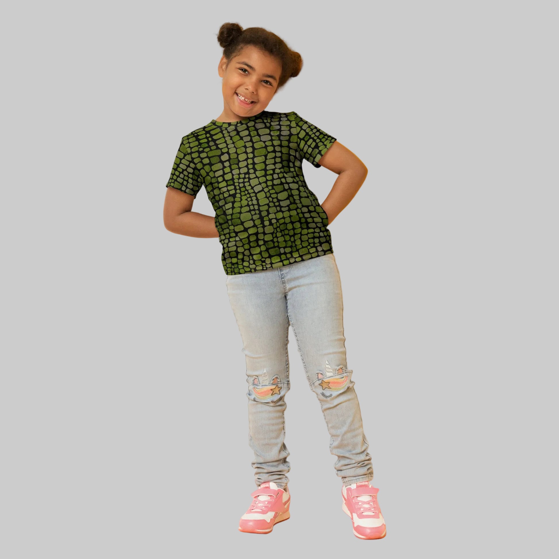 Green scale reptile print kids t-shirt in sizes 2T–7, designed for imaginative play and costume fun. Perfect for dinosaur, lizard, snake, or serpent-themed outfits, this all-over print tee features vivid green scales and a soft, comfy fit. Ideal for Halloween, dress-up days, or jungle animal birthday parties. A must-have for kids who love reptiles and creative play, this shirt brings wild adventures to life.