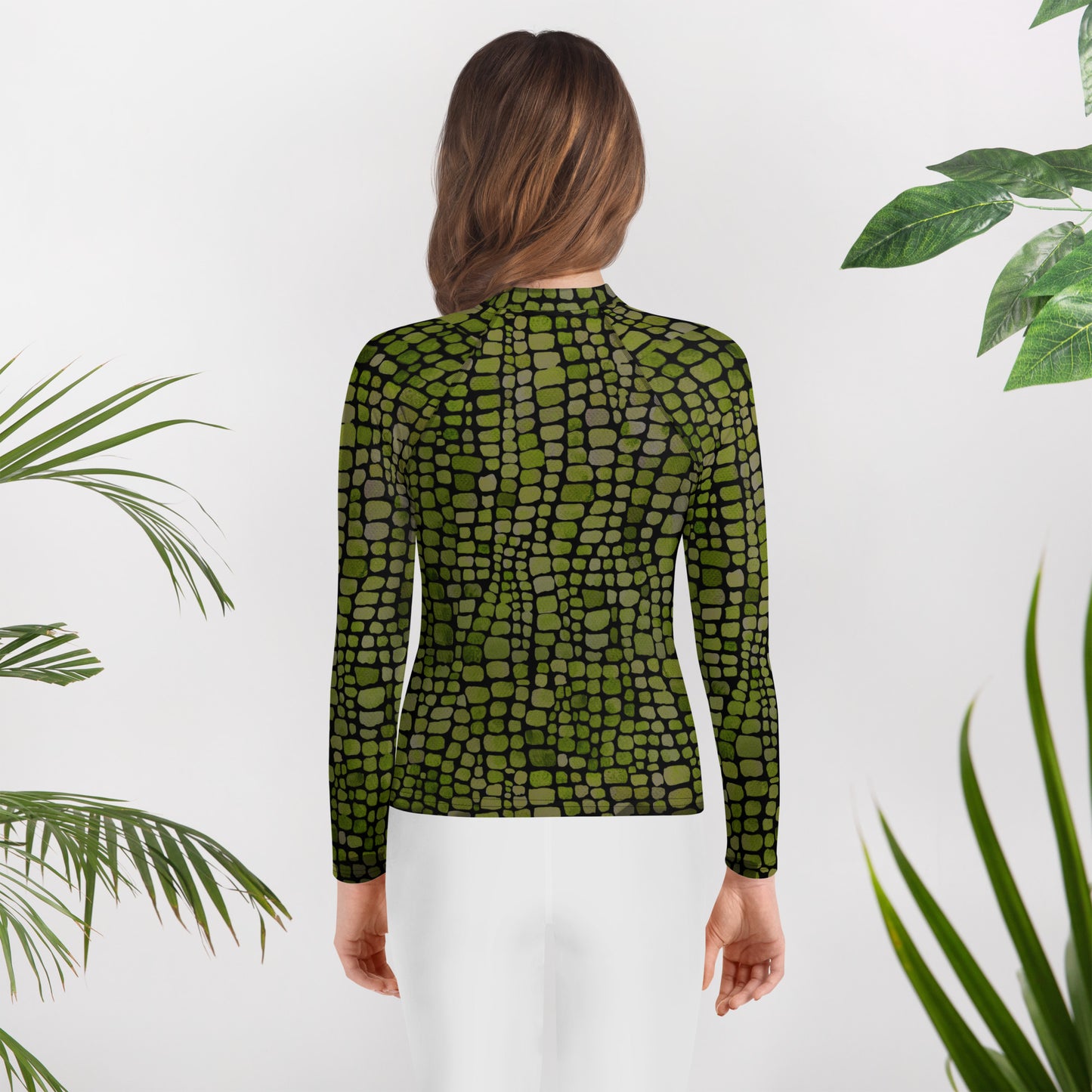 All-over green scale youth rash guard in sizes 8–20, ideal for costume play, summer swimming, and themed events. Great for kids who love dinosaurs, snakes, or jungle creatures, this sun-protective long sleeve shirt is made for imaginative outdoor fun. Whether it’s for water activities, cosplay, or reptile-themed vacations, this comfortable rash guard is a bold statement piece with UPF 50+ fabric and vivid print.