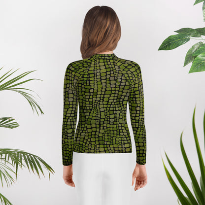 All-over green scale youth rash guard in sizes 8–20, ideal for costume play, summer swimming, and themed events. Great for kids who love dinosaurs, snakes, or jungle creatures, this sun-protective long sleeve shirt is made for imaginative outdoor fun. Whether it’s for water activities, cosplay, or reptile-themed vacations, this comfortable rash guard is a bold statement piece with UPF 50+ fabric and vivid print.