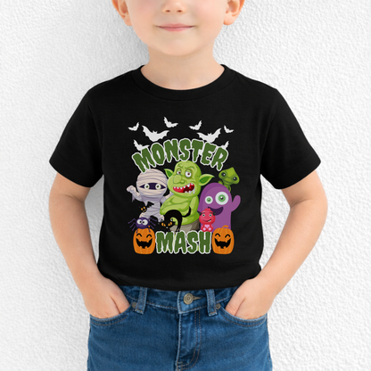 Halloween Monster Mash graphic t shirt featuring fun cartoon style spooky characters including ghost, mummy, zombie, troll, black cat, bats, and pumpkins printed on a black Bella Canvas tee. The design has bold green slime Monster Mash text, making it a festive Halloween shirt for kids and adults, perfect for fall outfits, school parties, trick or treat night, and family matching Halloween looks.