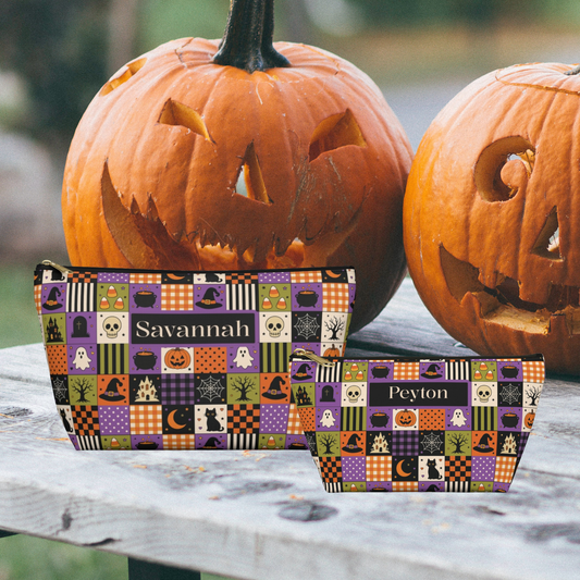 Halloween makeup bag featuring custom name personalization on a vintage patchwork design with pumpkins, ghosts, witches hats, black cats, skulls, cauldrons and spiderwebs in orange, purple, green, black and cream. Cute spooky toiletry pouch for teens and adults.