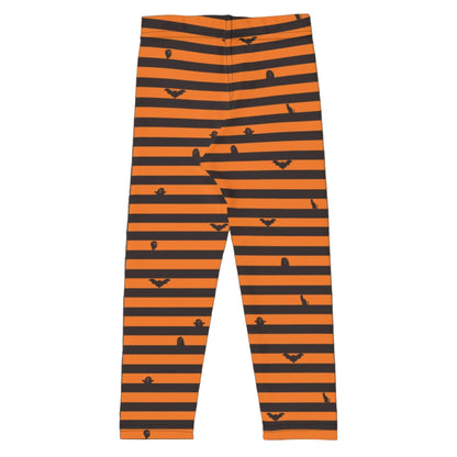 Halloween themed toddler leggings in a black and orange stripe pattern styled for a festive fall kids outfit