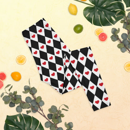 Full length black and white checker diamond print ladies leggings with red heart accent, featuring a comfortable mid rise waistband, perfect for yoga, running, casual wear, lounging, valentines day outfits, family matching ensembles, balletcore or lavender girl style, and Queen of Hearts costume cosplay, soft stretchy fabric provides all day comfort and flattering fit for women of all sizes