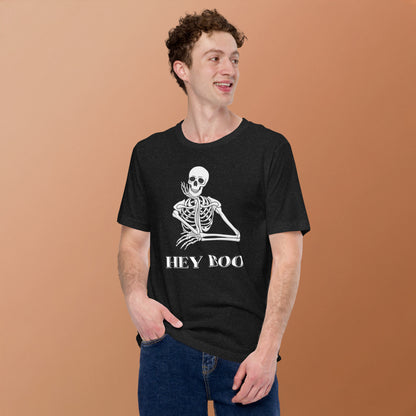 Celebrate spooky season in style with this Hey Boo Skeleton T-Shirt, crafted on a Bella Canvas 3001 for comfort and quality. Featuring a cheeky skeleton design and the words “Hey Boo,” this funny Halloween shirt is perfect for both men and women who want a playful fall look. Available in Black Heather and sizes XS–5XL, this unisex graphic tee is a must-have for trick-or-treating, Halloween parties, or pairing with cozy fall layers.