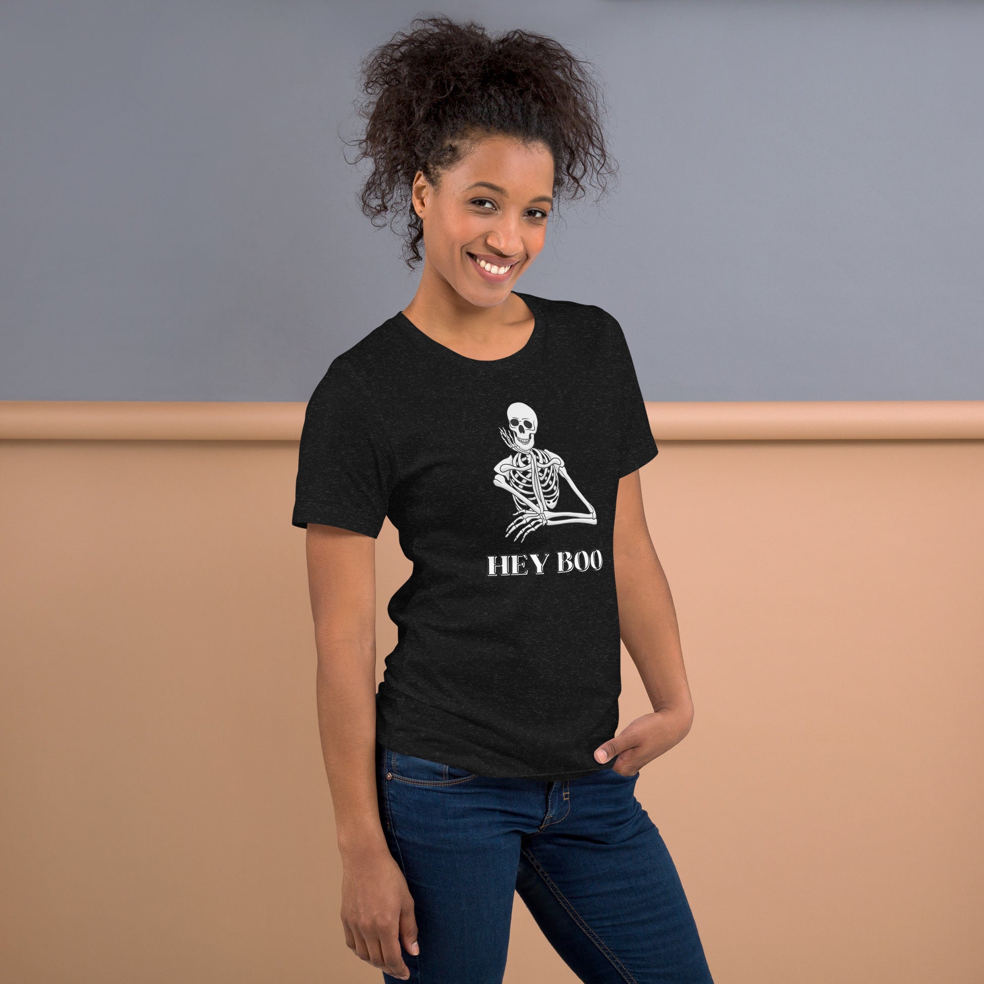 Show off your Halloween spirit with this Hey Boo Skeleton Shirt, a playful unisex tee printed on the soft and durable Bella Canvas 3001. Featuring a smiling skeleton and the fun phrase “Hey Boo,” this Halloween graphic tee is perfect for both casual fall days and festive parties. With sizes XS–5XL, it’s an inclusive fit for everyone looking to add humor and charm to their spooky season outfits. Black Heather color makes it easy to style with jeans or leggings.