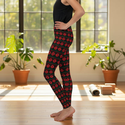 Holiday poinsettia leggings for girls featuring a repeating red, green and black Christmas pattern with vibrant poinsettias and leafy accents. Full length with a high rise waist and available in sizes 2T–20, these festive leggings are ideal for Christmas outfits, celebrations and matching looks.