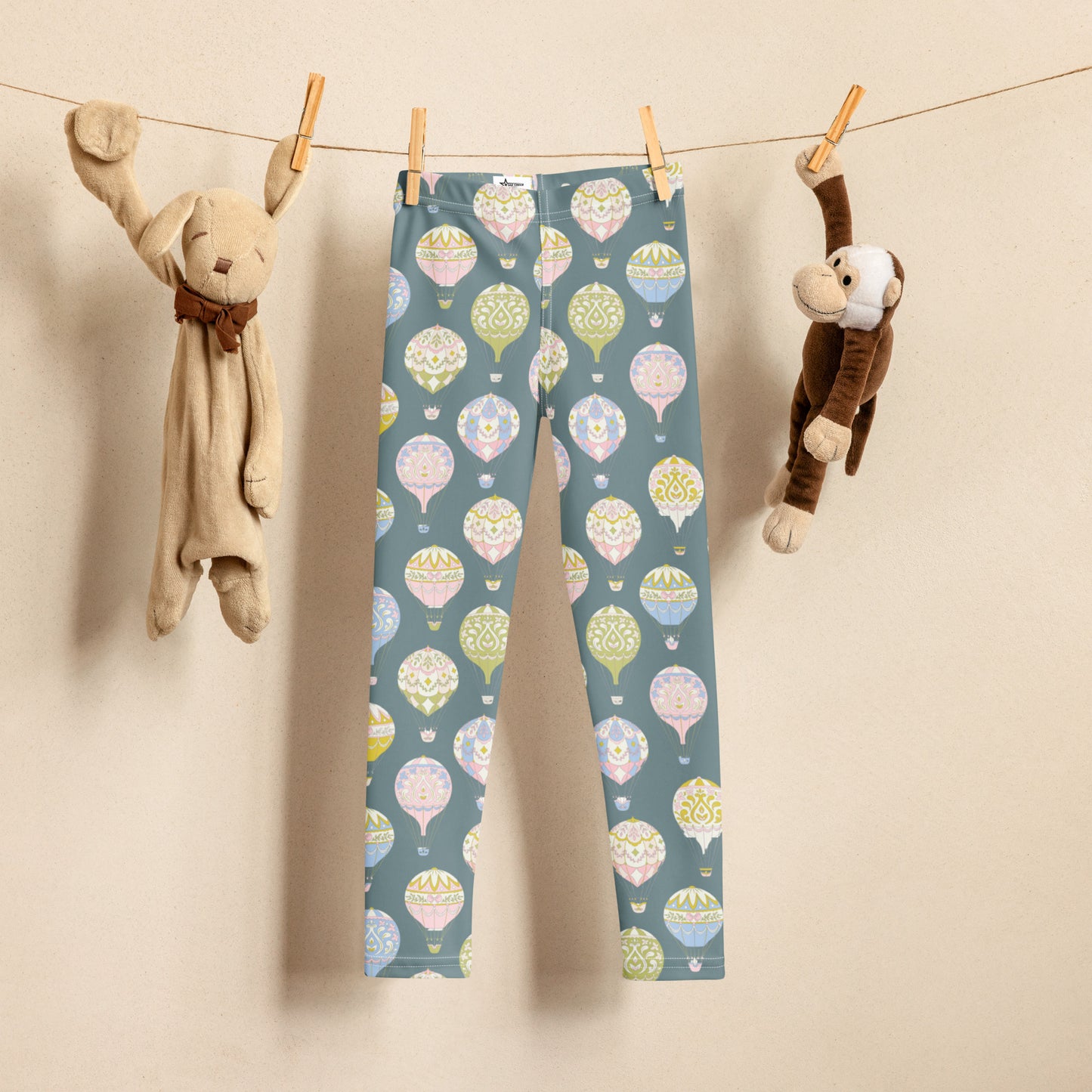 Grey toddler leggings featuring soft pastel Victorian hot air balloons, designed for girls sizes 2T–7. Comfortable stretch and an elastic waistband make them ideal for everyday play, photo sessions, and casual outings. Perfect for spring outfits, birthday gifts, festival days, and even mommy-and-me matching sets. Durable microfiber fabric keeps colors vibrant wash after wash, combining playful charm with practical wear for active little girls.