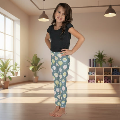 Soft grey toddler leggings with pastel Victorian hot air balloons, available in girls sizes 2T–7. Comfortable and stretchy for everyday wear, these leggings are ideal for imaginative play, spring outings, photo sessions, and festival days. The elastic waistband ensures easy wear, and the durable microfiber fabric keeps the whimsical balloon print vibrant. Perfect for little girls who enjoy storybook-inspired fashion and mommy-and-me matching outfits.