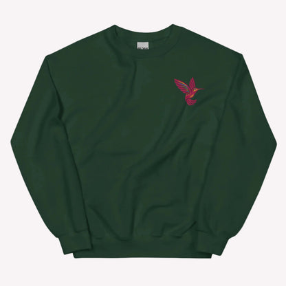Soft hummingbird embroidered sweatshirt with detailed bird design on classic Gildan 18000 unisex crewneck. Comfortable cotton and polyester blend ideal for everyday wear and layering. Nature inspired aesthetic perfect for women who love birds, gardens, and cozy outfits. Great for casual styling, travel, and gifting. Available in sizes S to 5XL.