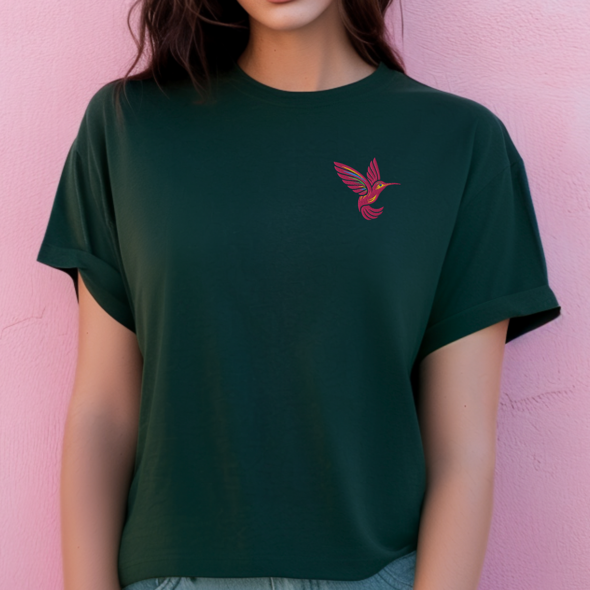 Nature lover shirt for women featuring a pink embroidered hummingbird on the left chest, a minimalist bird design that pairs easily with jeans, leggings and shorts, perfect for garden lovers, bird watchers, spring outfits, casual days and outdoor activities