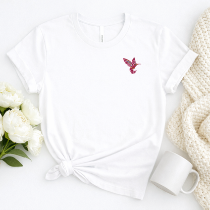 Hummingbird lover shirt for women featuring a pink embroidered hummingbird on the left chest of a soft Bella Canvas tee, a charming bird lover gift for gardeners, nature lovers and women who enjoy delicate embroidery and nature inspired clothing