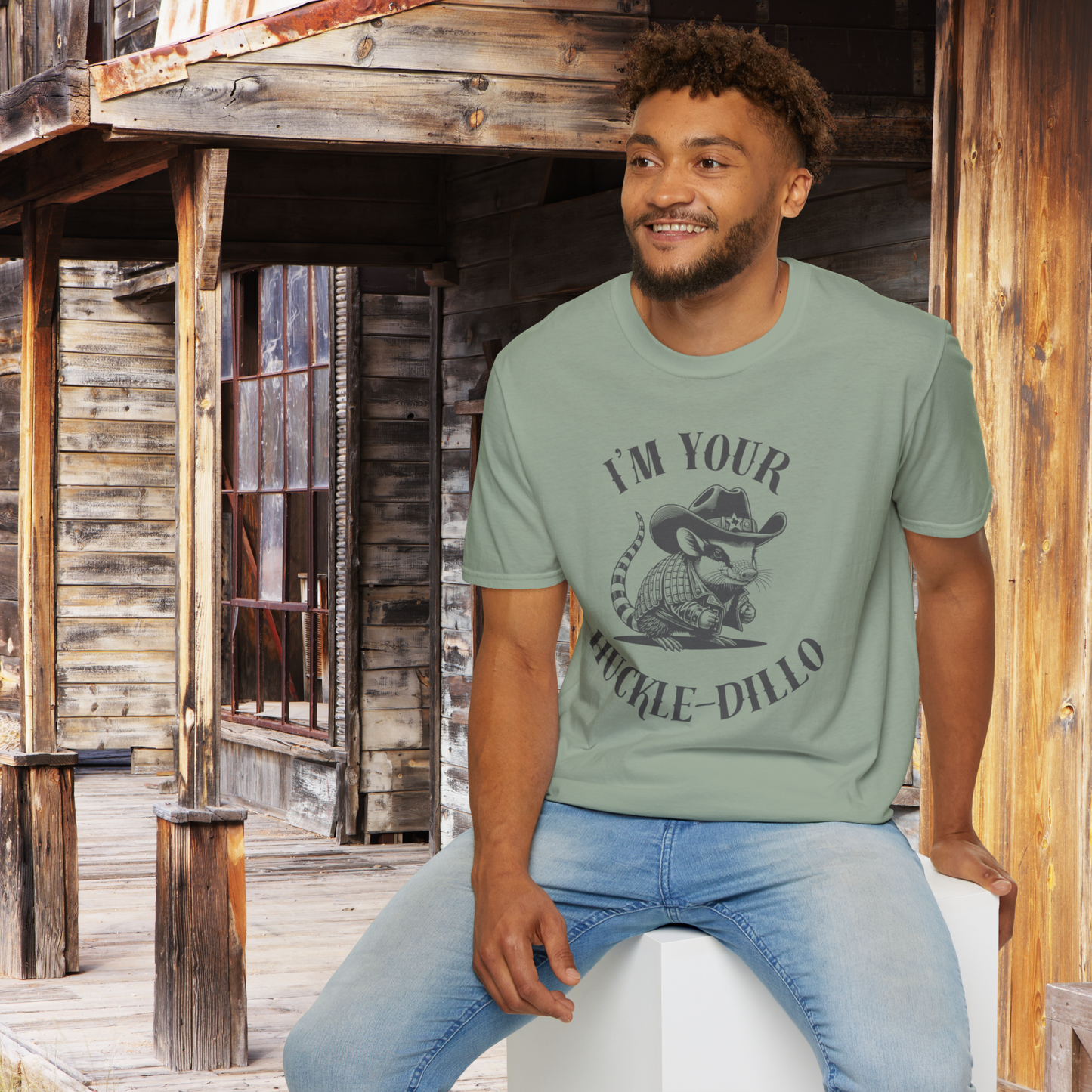 Image: A fun and creative T-shirt featuring a sheriff armadillo dressed in a cowboy hat and jacket. The hat is detailed with a small Texas emblem, making this tee a great Texas souvenir or a humorous gift for western fashion lovers. Ideal for rodeo fans, country music enthusiasts, and anyone who appreciates cute animal designs. This soft and comfortable tee is great for everyday wear, state fairs, or casual country outings, by jaecrece.