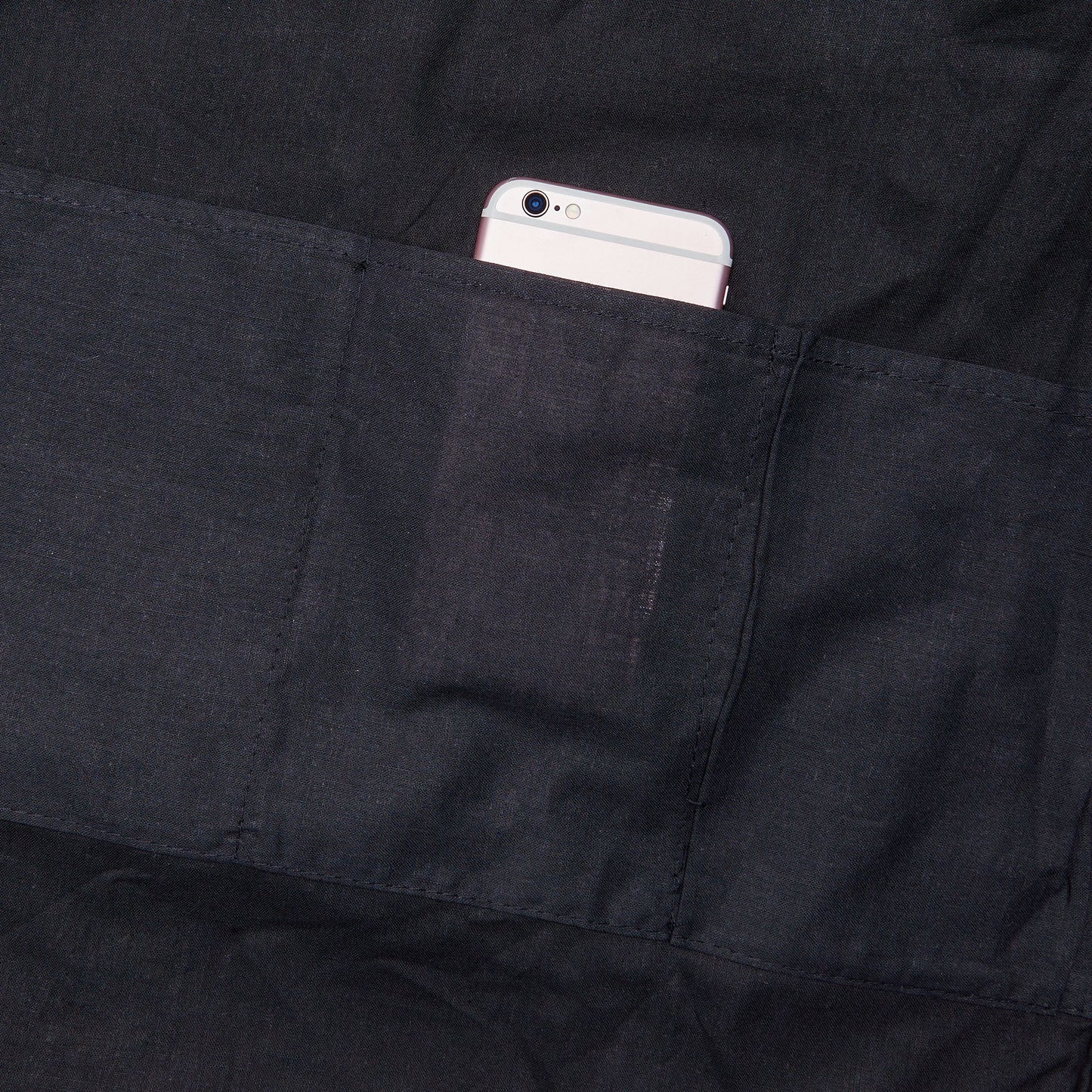 Black interior pocket with a smartphone inside