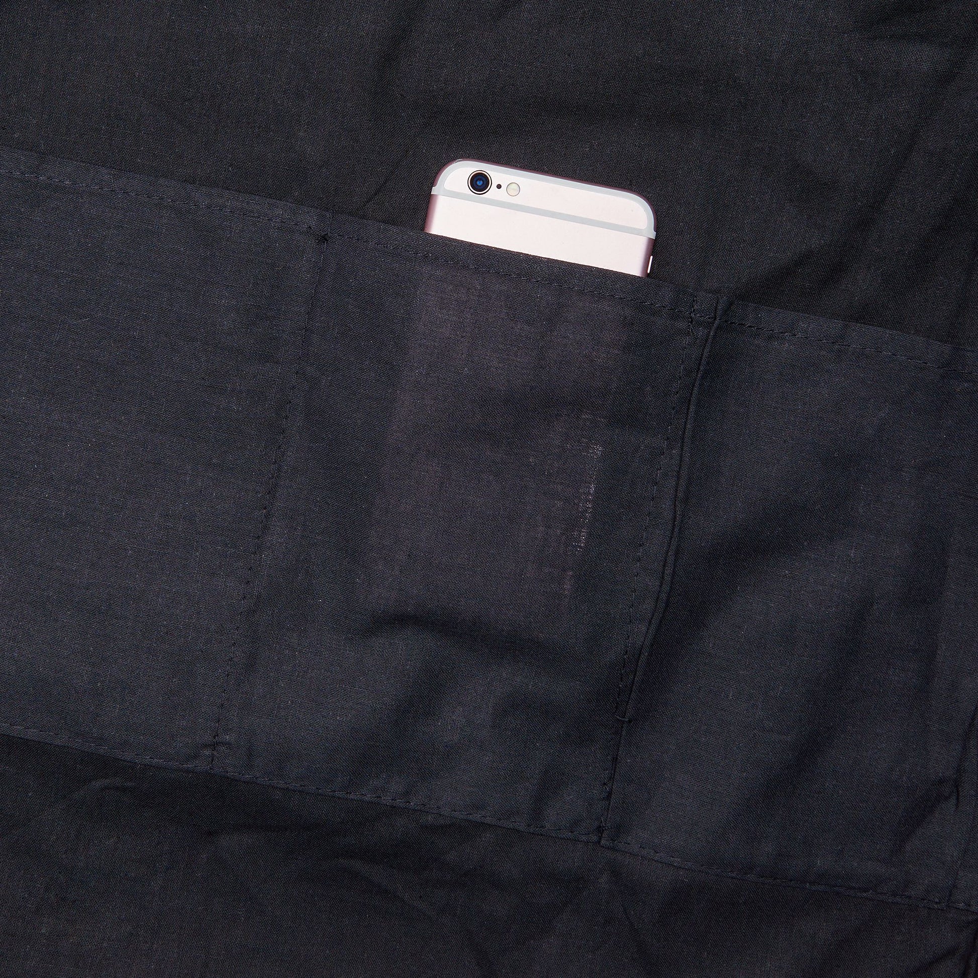 Black interior pocket with a smartphone inside