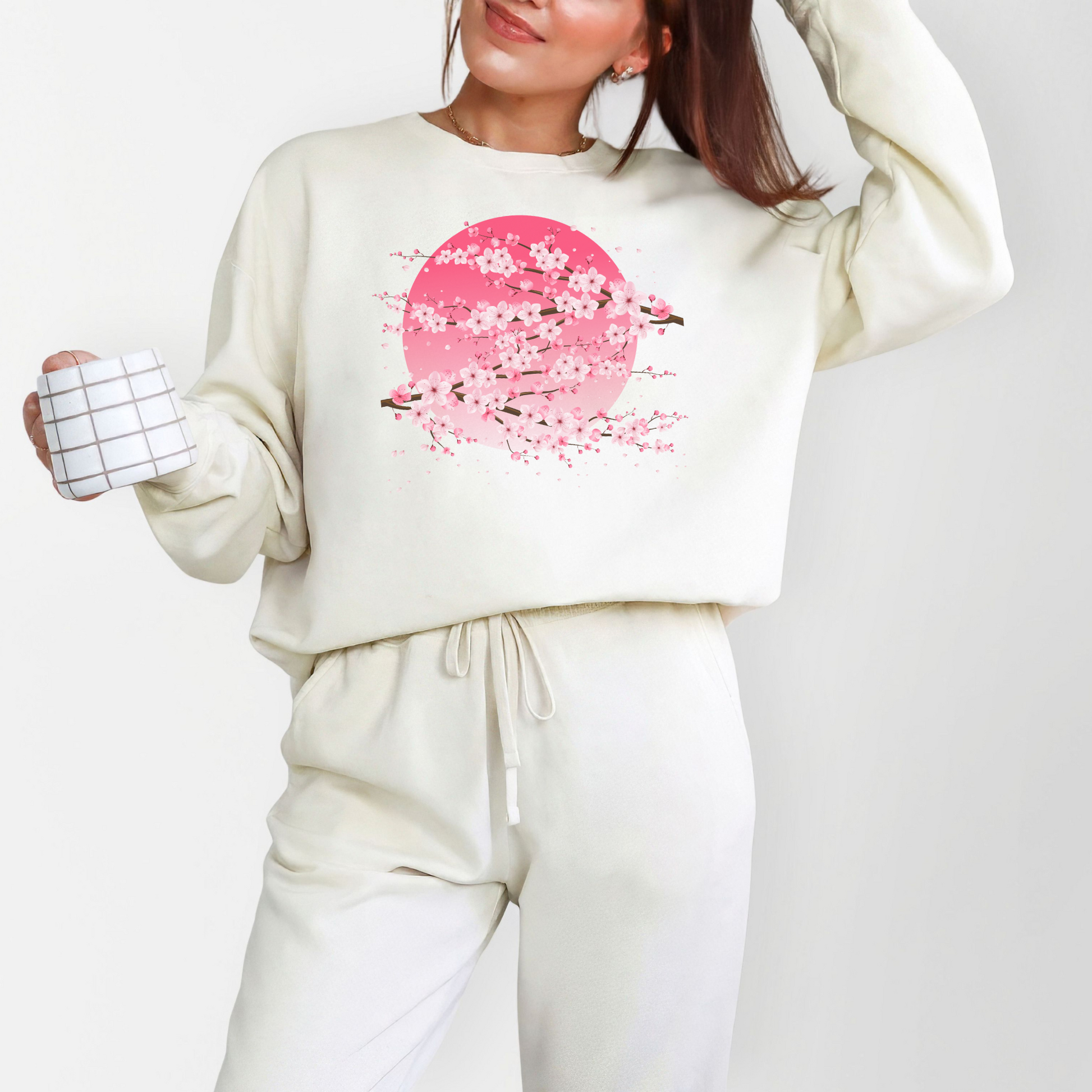 Image: Japanese Cherry Blossom Womens Comfort Colors 1466 sweatshirt featuring a serene pink moon design with delicate Japanese cherry blossom (sakura) branches. This cozy, vintage washed crewneck offers a relaxed fit, perfect for casual wear. Inspired by Japanese aesthetics, this sakura sweatshirt captures the beauty of nature and the fleeting elegance of cherry blossoms under a moonlit sky. Ideal for spring outfits, hanami festivals, or anyone who loves Japanese inspired fashion and celestial designs.